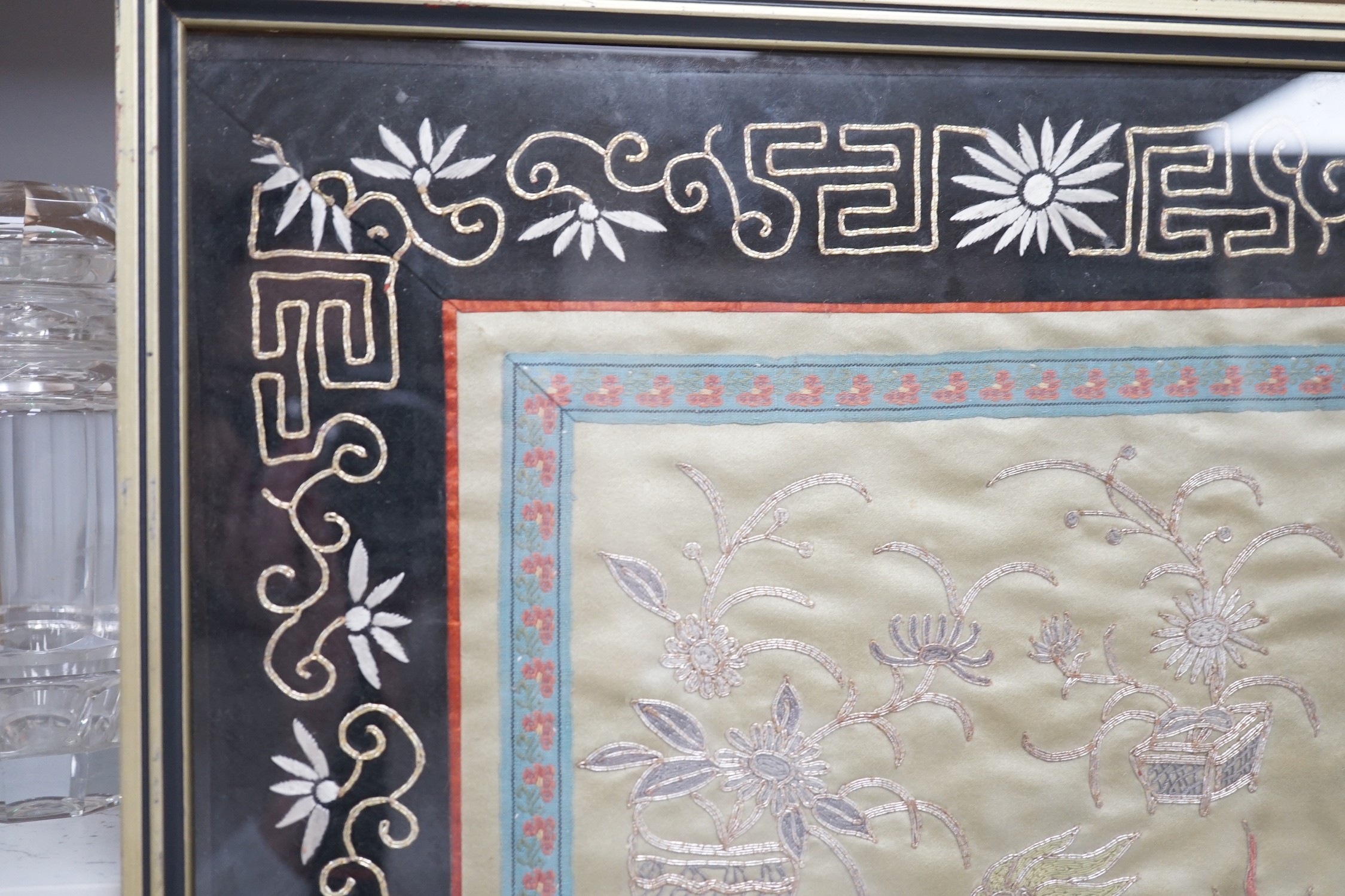 A framed Chinese dragon silk panel. 64 x 34cm